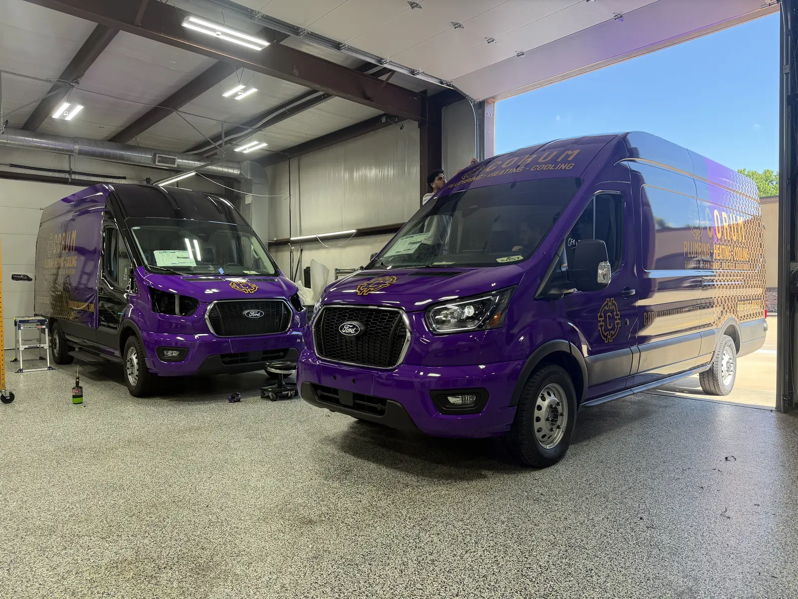 Corum fleet — two more in the booth — Ford Transits